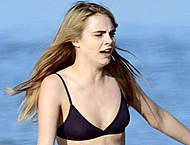 Cara Delevingne filming in sexy black bikini
