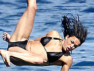 Michelle Rodriguez in black bikini on a boat