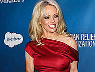 Pamela Anderson pokies under red night dress