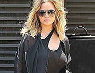 Busty Chrissy Teigen in see through black top