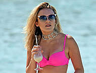 Tallia Storm sexy in pink bikini on a beach