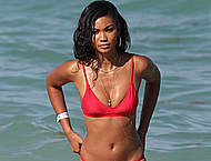 Chanel Iman in red tiny bikini on a beach
