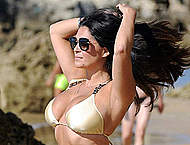 Busty Casey Batchelor in bikini on a beach