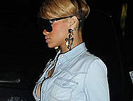 Rihanna shows her sexy legs & slight cleavage