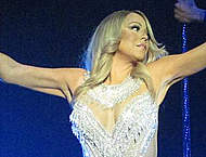 Mariah Carey performing on a stage in Glasgow Mariah Carey performing on a stage in Glasgow